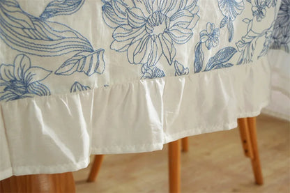 Coton tablecloth with blue embroidery and ruffles